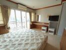 Spacious bedroom with natural light and modern amenities