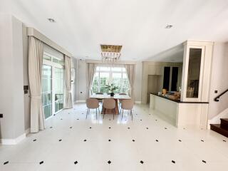 Spacious dining room with natural light and modern decor