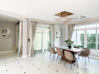 Modern dining room with large windows and elegant design