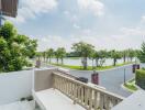 Balcony view overlooking a scenic lake with lush greenery