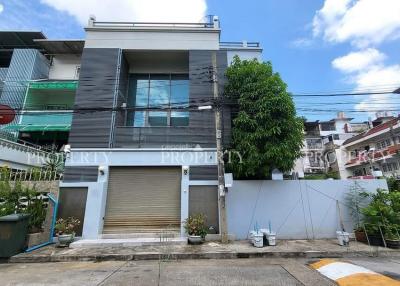 Modern urban building with garage and balcony