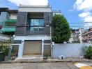 Modern urban building with garage and balcony