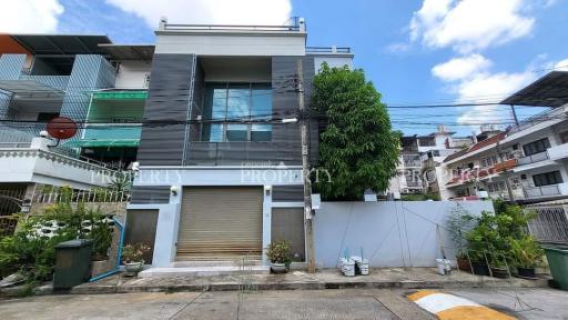 Modern urban building with garage and balcony