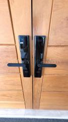 Modern digital security lock on wooden door