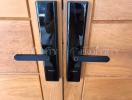 Modern digital security lock on wooden door