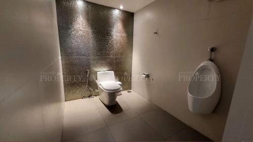 Modern bathroom with toilet and urinal