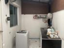 Compact indoor kitchen with washing machine and basic appliances