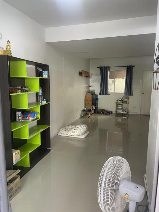 Bright bedroom with open shelves and polished floor