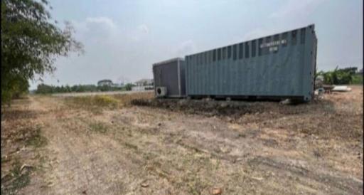 Converted shipping container on open land