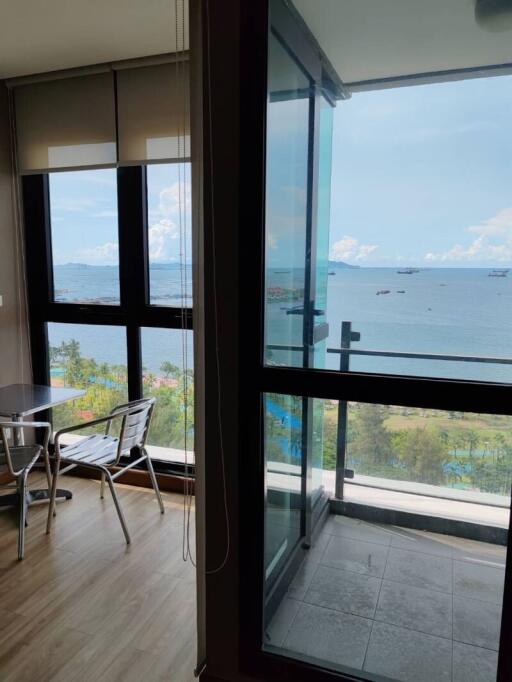 Modern living room with large windows overlooking the ocean