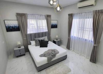 Modern and bright bedroom with white interiors and elegant decor