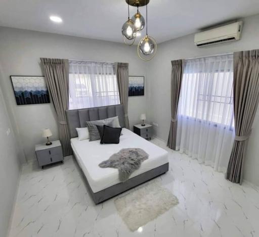 Modern and bright bedroom with white interiors and elegant decor