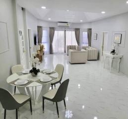 Spacious and elegantly furnished living room with dining area