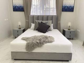 Elegant modern bedroom with double bed and stylish decor