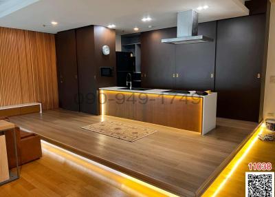 Modern kitchen with wooden floor and bar counter