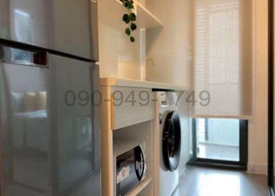 Modern kitchen with built-in appliances and ample shelving