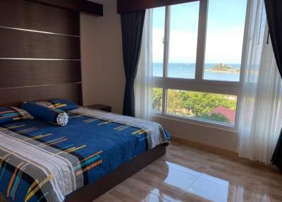 Spacious bedroom with ocean view and ample natural light