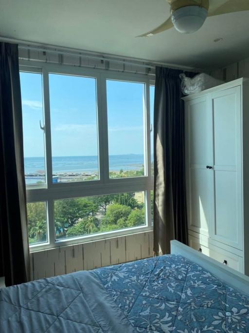 Cozy bedroom with ocean view and ample natural light