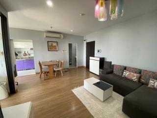 Spacious living room with modern furniture and open kitchen