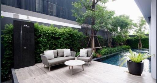 Modern outdoor patio with seating and pool