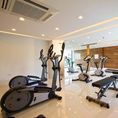 Well-equipped modern home gym with various exercise machines