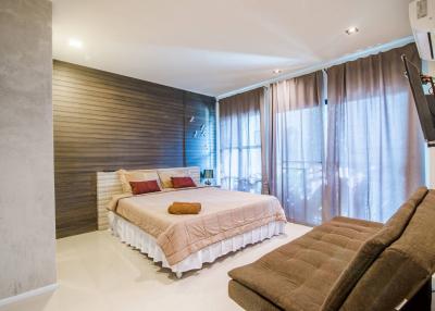 Elegant modern bedroom with large bed and stylish decor