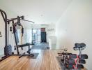 Spacious home gym with various exercise equipment