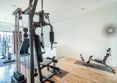 Modern home gym with various exercise equipment