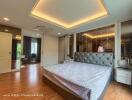 Spacious master bedroom with modern design and ample lighting