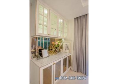 Modern kitchen with white cabinetry and marble countertop