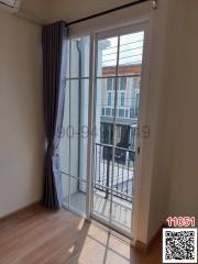 Bright bedroom with large window and balcony access