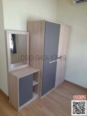 Modern bedroom with wooden wardrobe and vanity