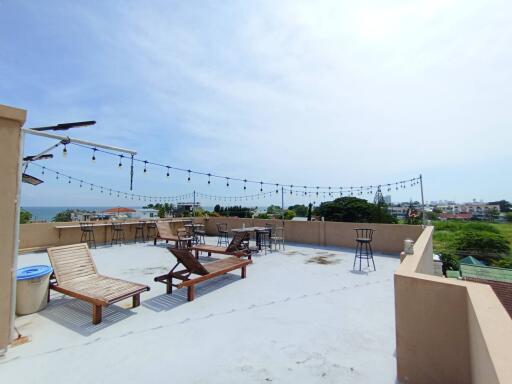 Spacious rooftop terrace with seating and a view