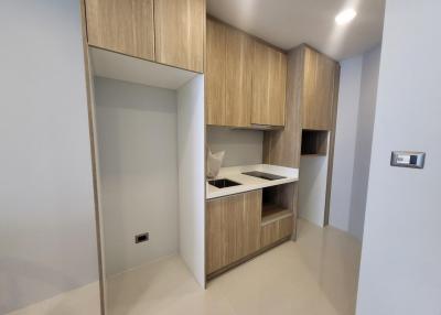 Modern bedroom with built-in wooden wardrobe and sleek design