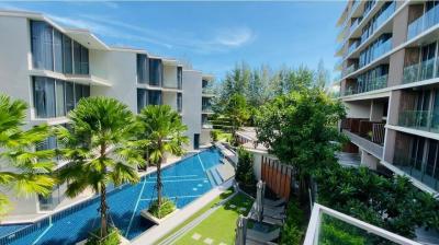 Modern residential building complex with pool and garden area