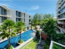 Modern residential building complex with pool and garden area