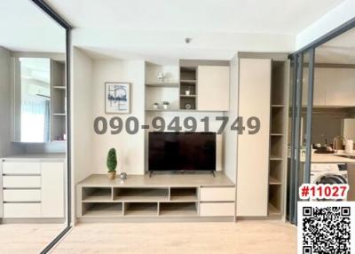 Modern living room interior with television and shelving unit