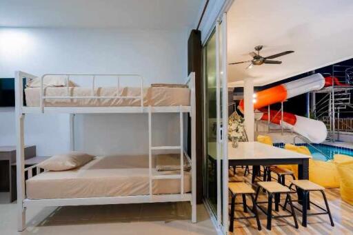 Cozy bedroom with bunk beds and direct access to a living area with modern amenities