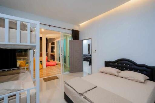 Spacious bedroom with a large bed and direct access to the living area
