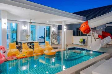 Luxurious pool area with direct access to the living space and playful inflatables