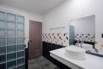 Modern bathroom interior with geometric tile design