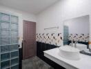 Modern bathroom interior with geometric tile design
