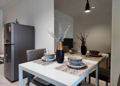 Modern dining area with table set for meal