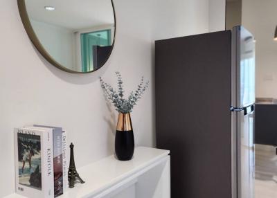 Modern hallway interior with refrigerator and decorative items