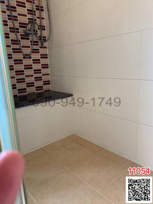 Tiled bathroom with shower