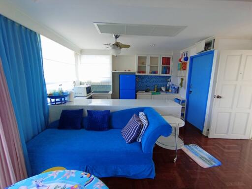 Bright and spacious living room with integrated kitchen area