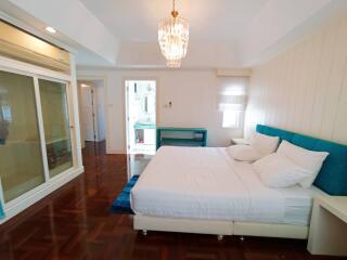 Spacious bedroom with en-suite bathroom and balcony access