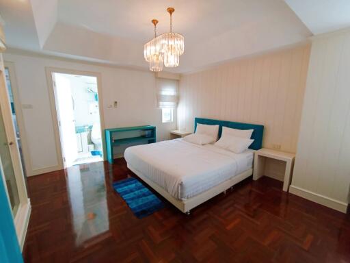 Spacious bedroom with en-suite bathroom and hardwood flooring