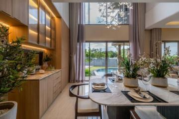 Elegant dining area with natural lighting and pool view