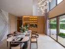 Elegant dining room with high ceiling and modern chandelier